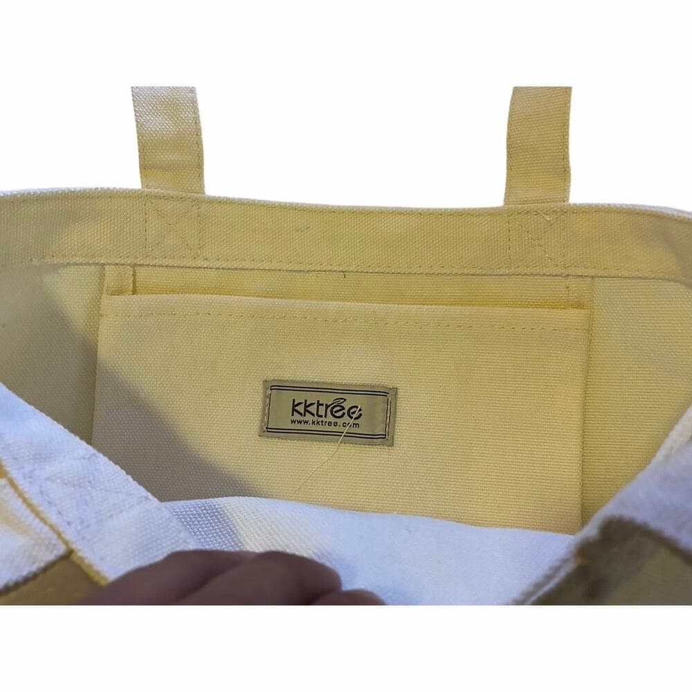 black tote bag featuring an artistic graphic print 13” W X 17” L - Thumbnail 2