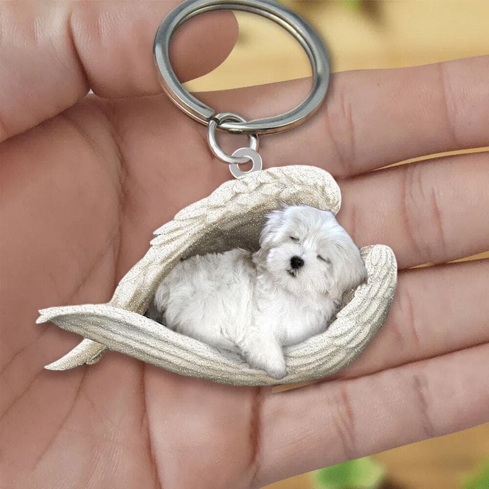 Maltese Sleeping Angel acrylic keychain With The Name Mattie On It