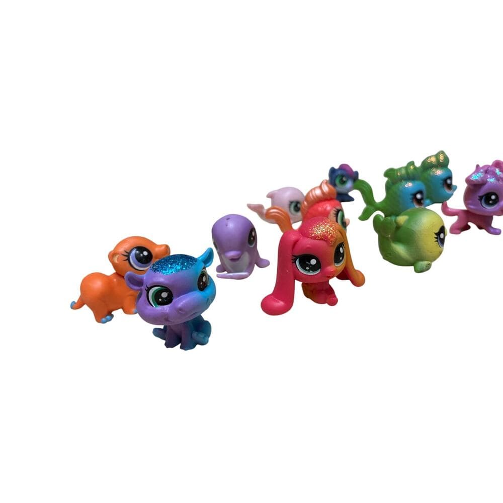 12 Pcs collection of Hasbro Littlest Pet Shop (LPS) mini figures.
