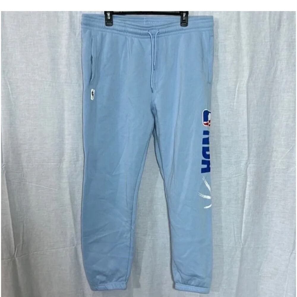 Vintage NBA light blue sweat pants. Size XL. NBA logo on left leg. In good preow