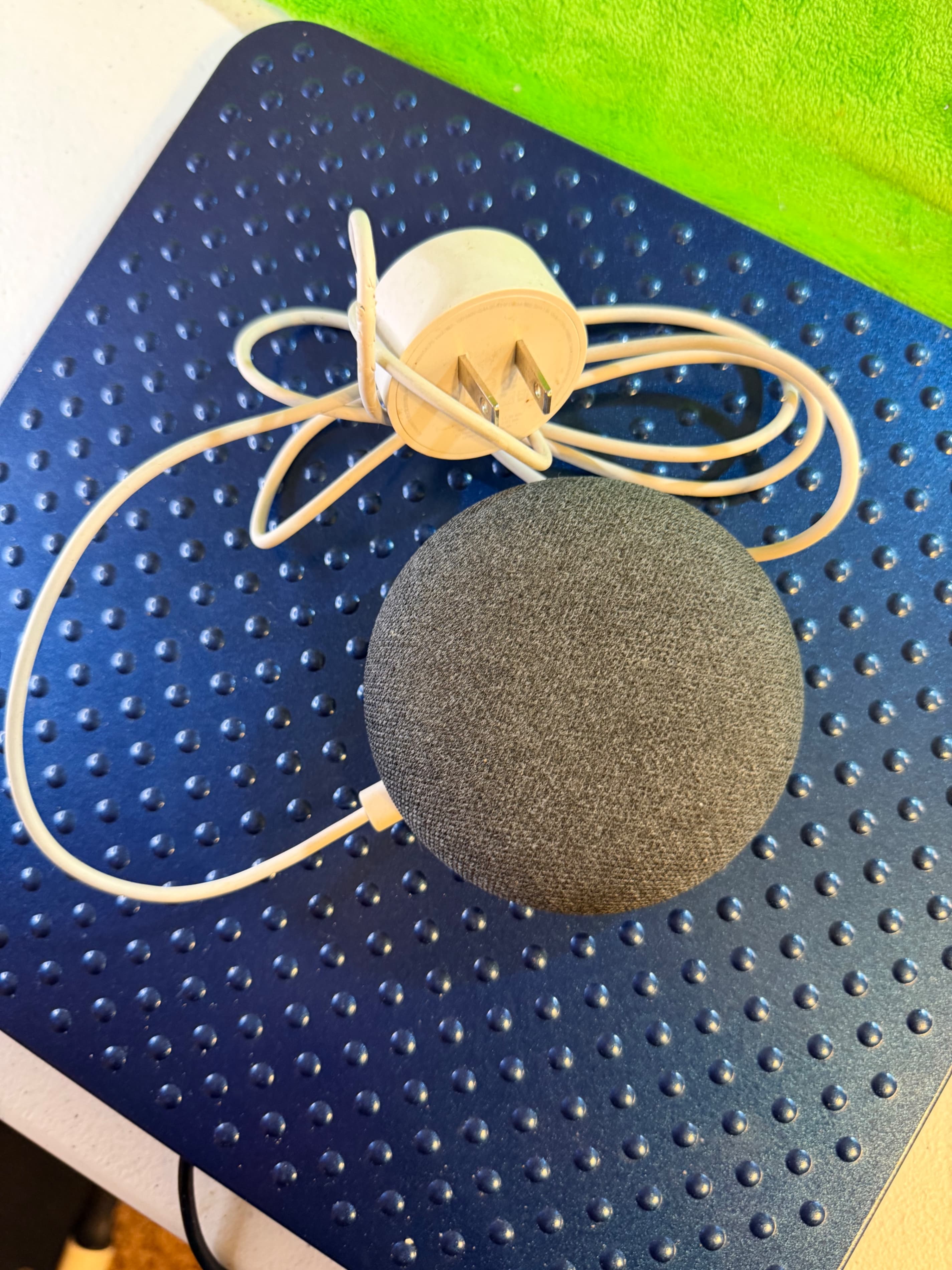 Google Home Mini smart assistant speaker in charcoal with an orange base - Thumbnail 2