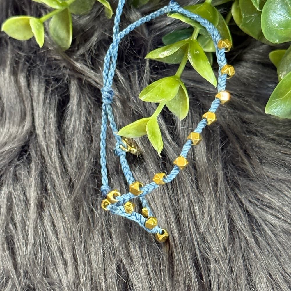 Pura Vida Blue Braided Bracelet with Gold Beads