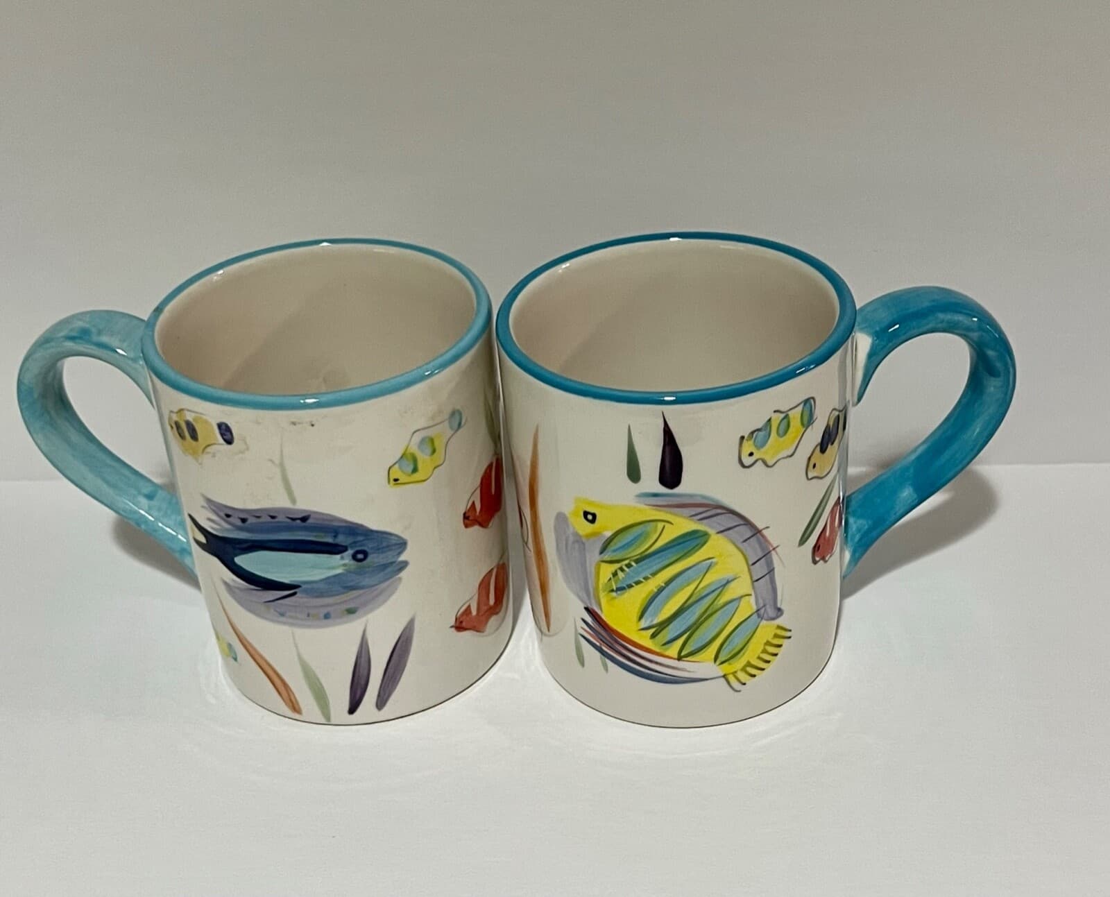 Pair of Handpainted White Mugs with Cartoon Fish and Blue Handle