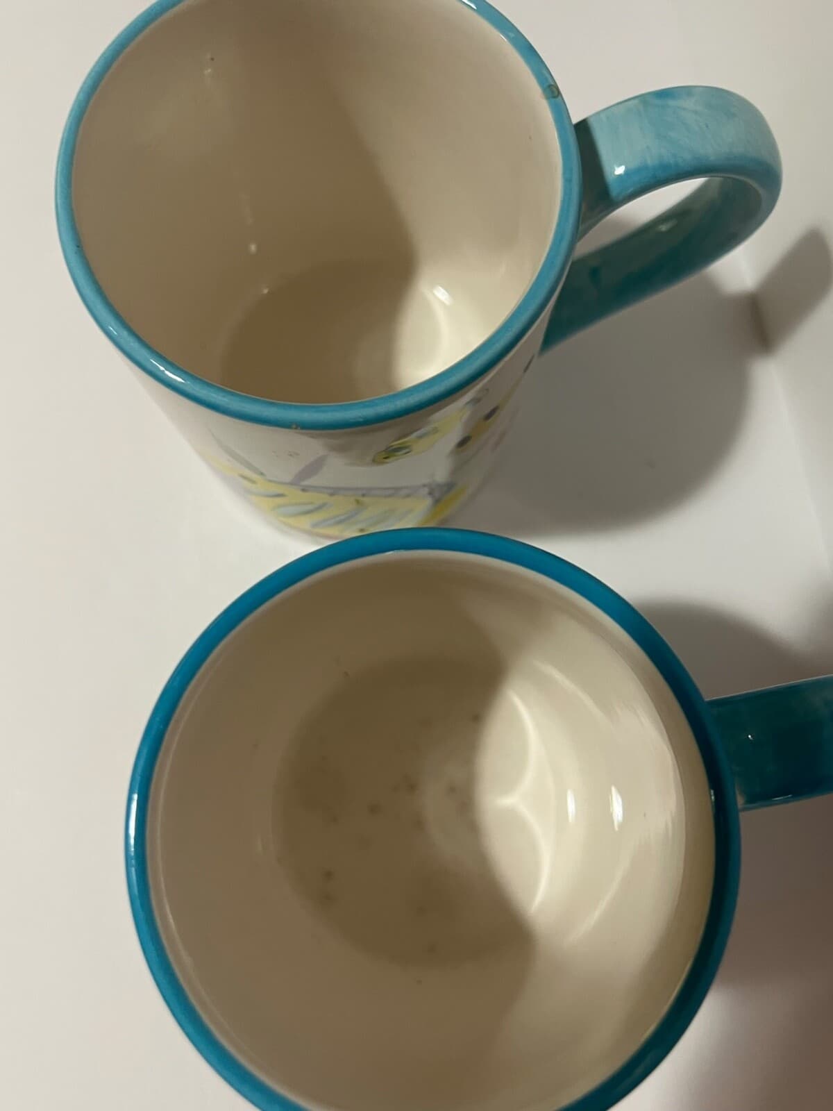Pair of Handpainted White Mugs with Cartoon Fish and Blue Handle - Thumbnail 2