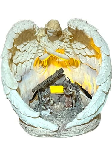 Nativity Manger Enveloped in the Wings of a Sculptured Angel. Has a Light.