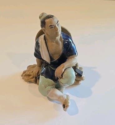 Ceramic Mud Man Figurine Sitting on Log 4"