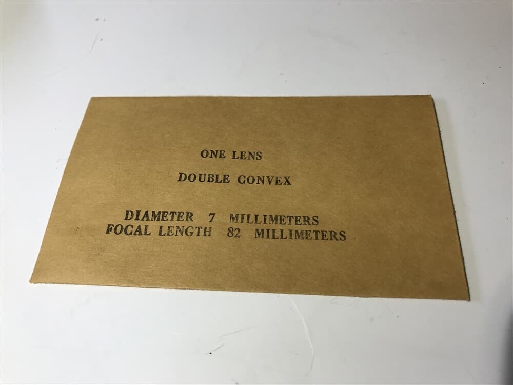 Edmund Scientific Double Convex Lens 7mm Diameter, 82mm Focal Length