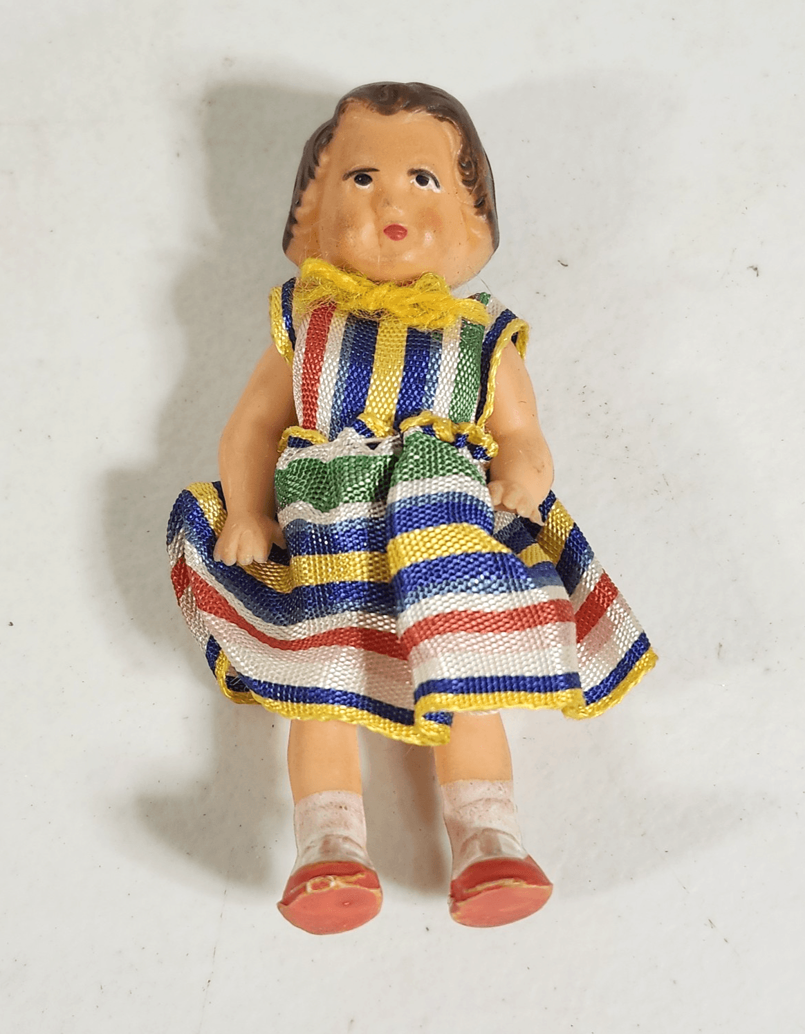 Vintage ARI German Rubber Doll 3" Toy Wearing Colorful Dress