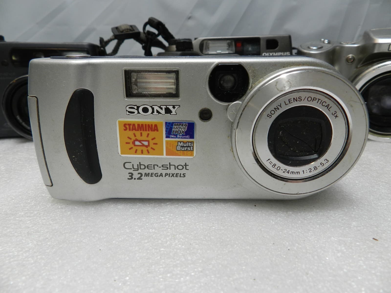 7 Assorted Digital Compact Cameras Olympus Kodak Sony Nikon (E77K) - Thumbnail 7