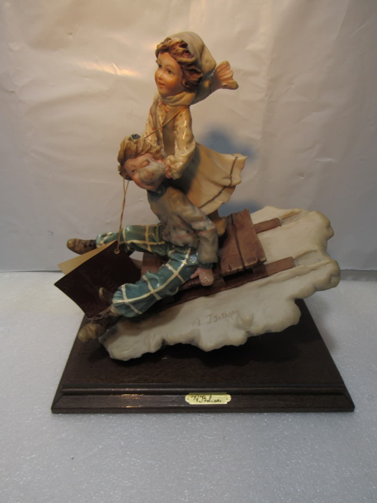 Vintage A. Belcari Boy and Girl Figurine Sledding Made in Italy 9.5" Tall (U7JJ