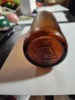 Antique Amber Clorox Bottle Glass Bottle 8"H x 3"D w/partial lid - Thumbnail 2