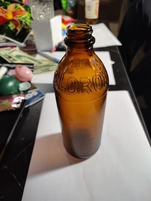 Antique Amber Clorox Bottle Glass Bottle 8"H x 3"D w/partial lid - Thumbnail 3