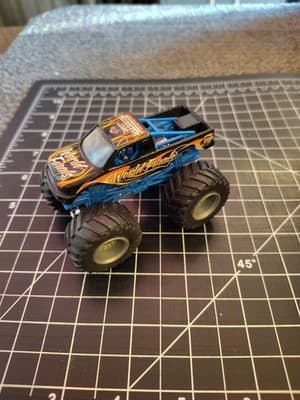 HOT WHEELS MONSTER JAM WORLD FINALS BLACK 1:64 DIECAST 3 1/2" TRUCK BLUE ORANGE - Thumbnail 2
