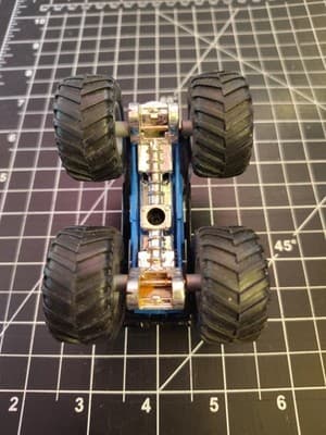 HOT WHEELS MONSTER JAM WORLD FINALS BLACK 1:64 DIECAST 3 1/2" TRUCK BLUE ORANGE - Thumbnail 5