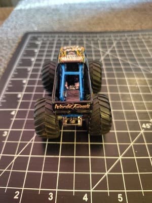 HOT WHEELS MONSTER JAM WORLD FINALS BLACK 1:64 DIECAST 3 1/2" TRUCK BLUE ORANGE - Thumbnail 4