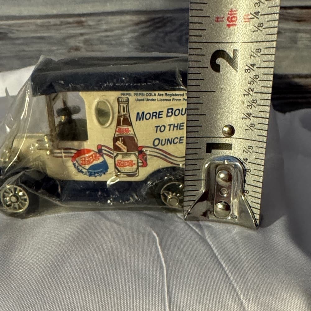 Pepsi Diecast Model Car with Blue and Cream Design