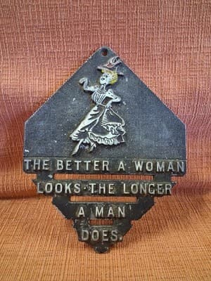 Vtg Metal Trivet "The Better A Woman Looks The Longer A Man Does" Wall Hanger US - Thumbnail 3