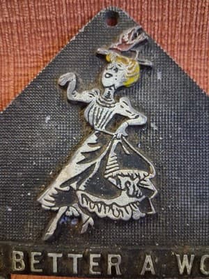 Vtg Metal Trivet "The Better A Woman Looks The Longer A Man Does" Wall Hanger US - Thumbnail 2