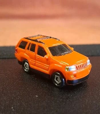 2003 Playmates Speedeez Jeep Grand Cherokee Micro Diecast SUV Orange - Thumbnail 2
