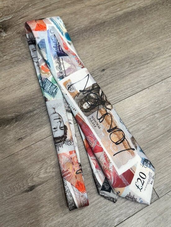 Vivienne Westwood silk tie featuring the iconic "Money" or "Currency" print.