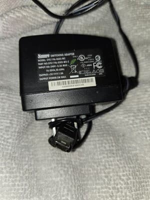 Sunny switching adapter, model number SYS1196-0605-W2. It is an AC-to-DC...