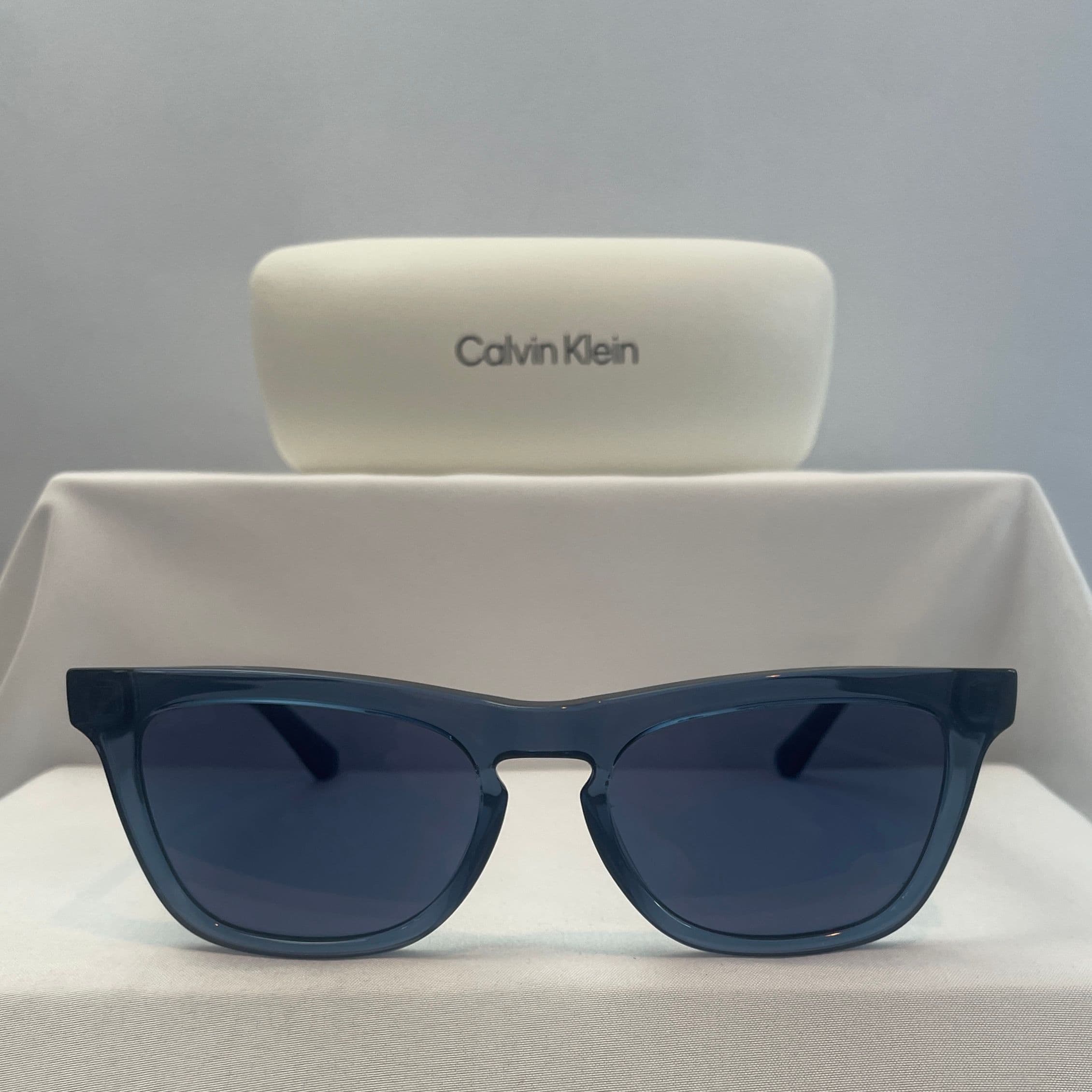 Calvin Klein Blue Rectangular Sunglasses with Blue Lenses and Keyhole Bridge