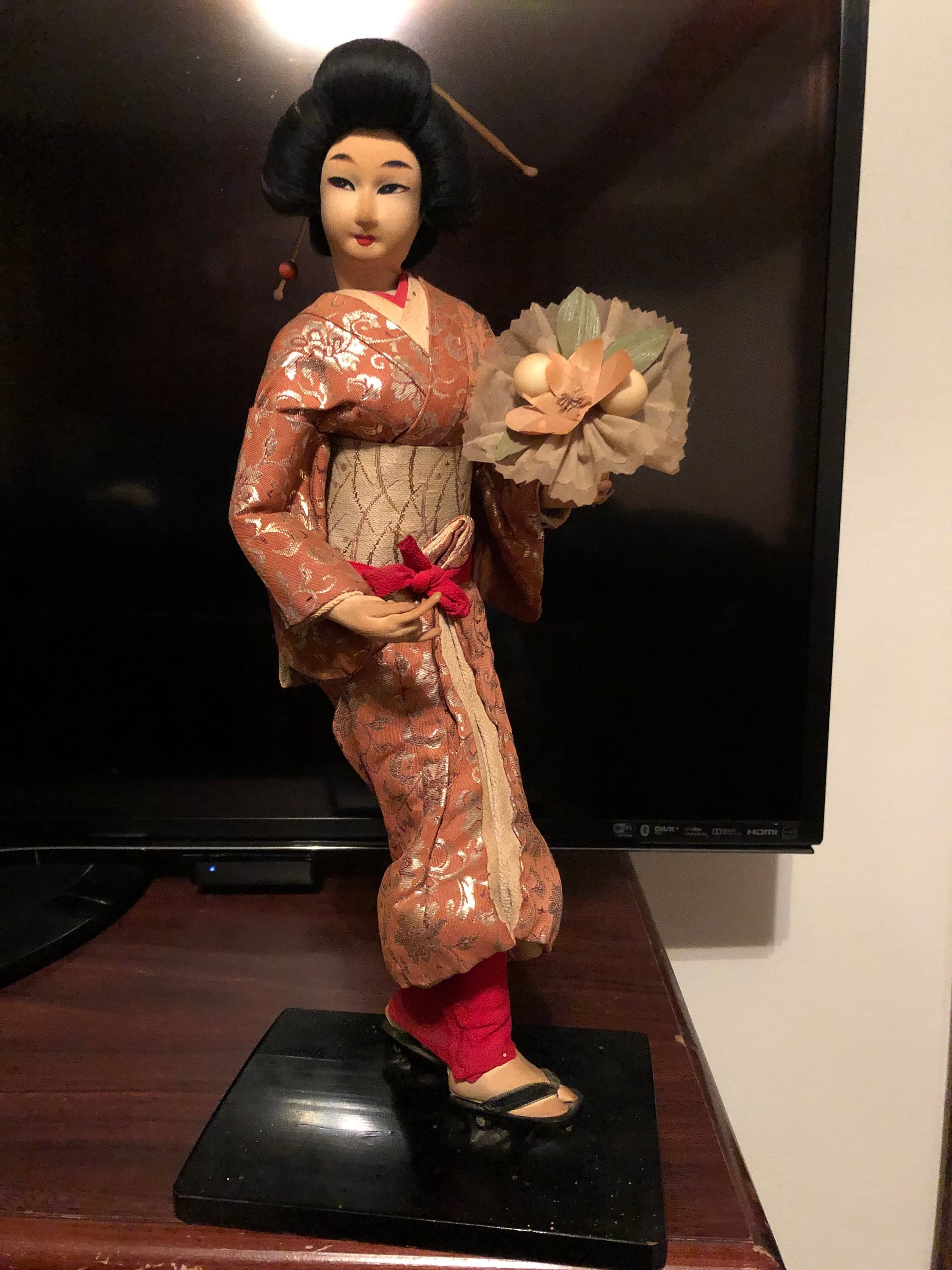 Geisha Performer with a flower bouquet on platform - Thumbnail 2