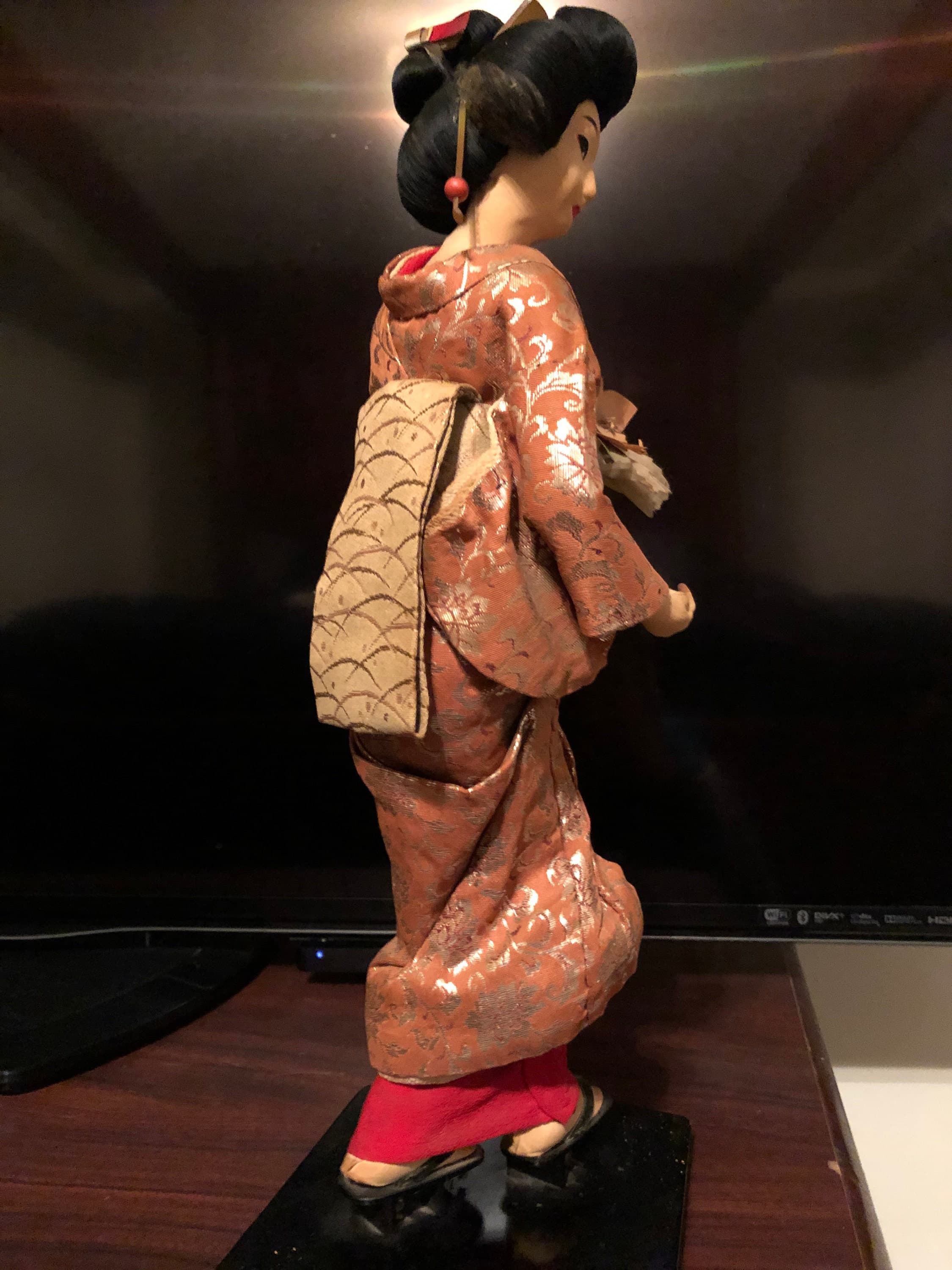 Geisha Performer with a flower bouquet on platform - Thumbnail 7