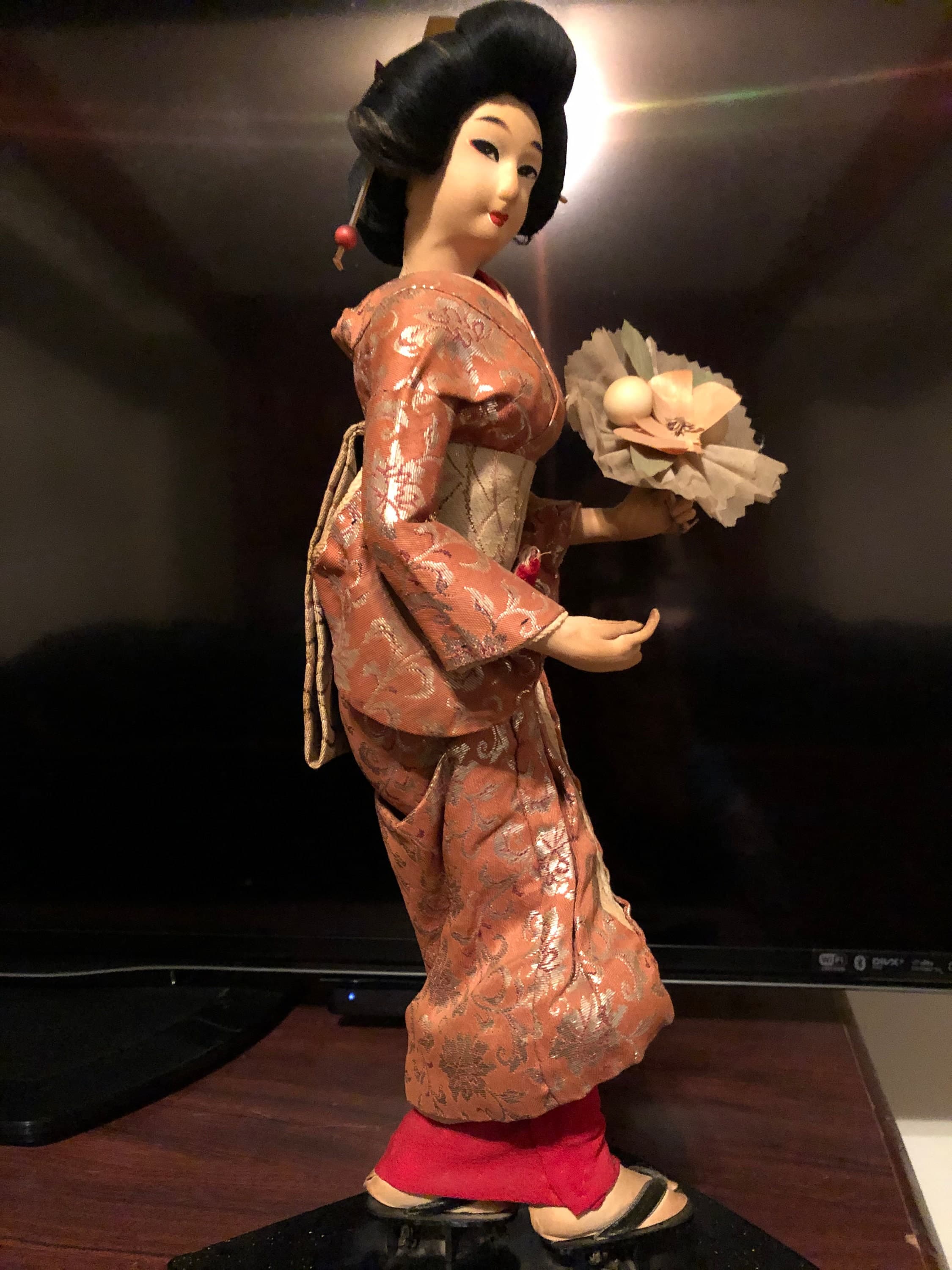 Geisha Performer with a flower bouquet on platform - Thumbnail 4