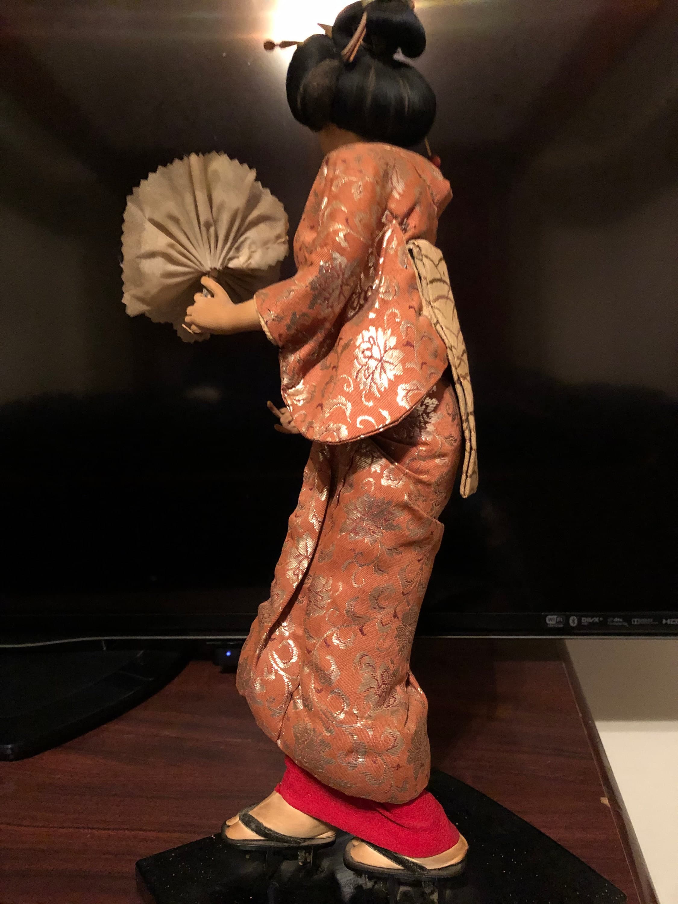 Geisha Performer with a flower bouquet on platform - Thumbnail 5
