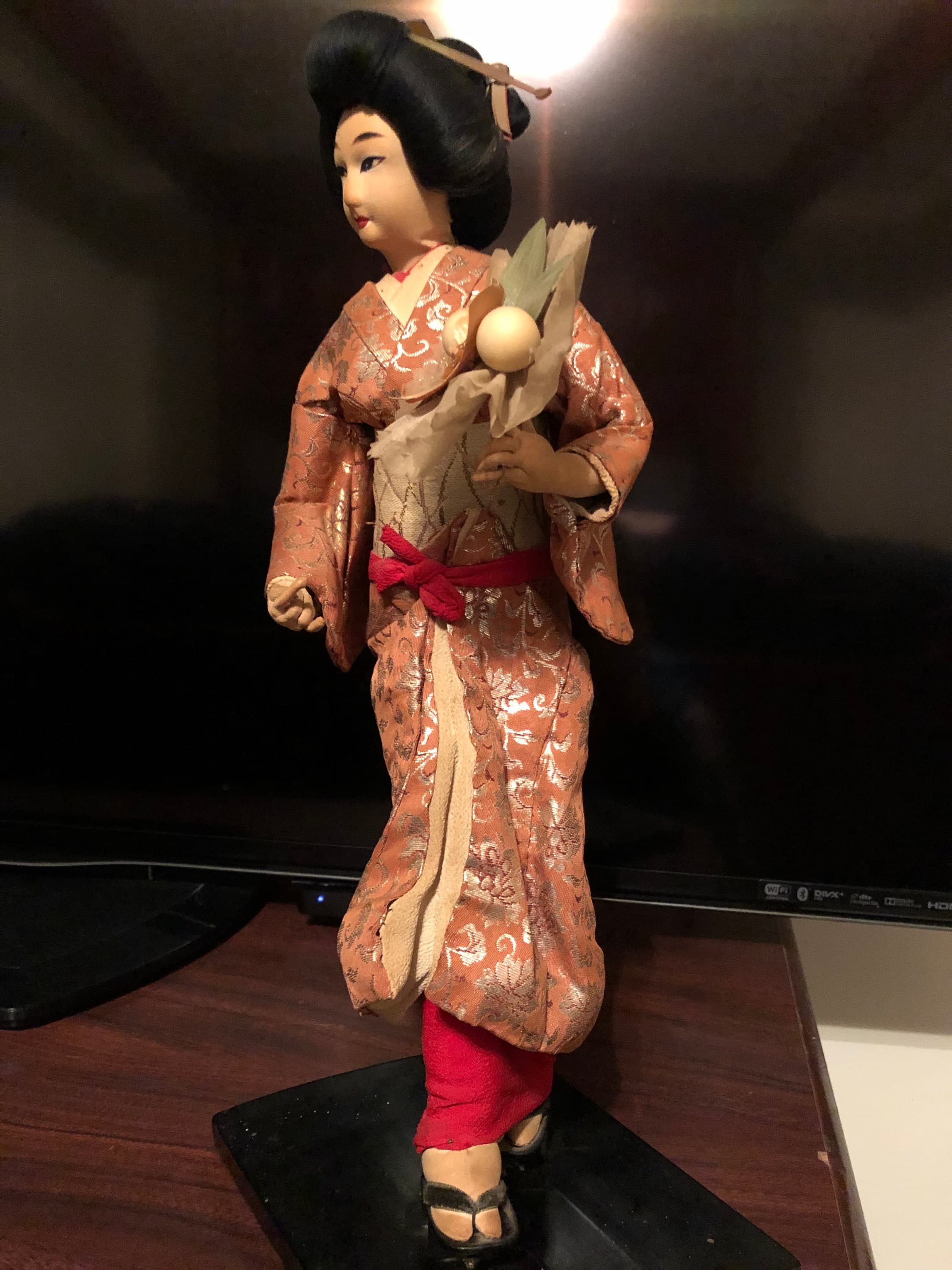 Geisha Performer with a flower bouquet on platform - Thumbnail 8