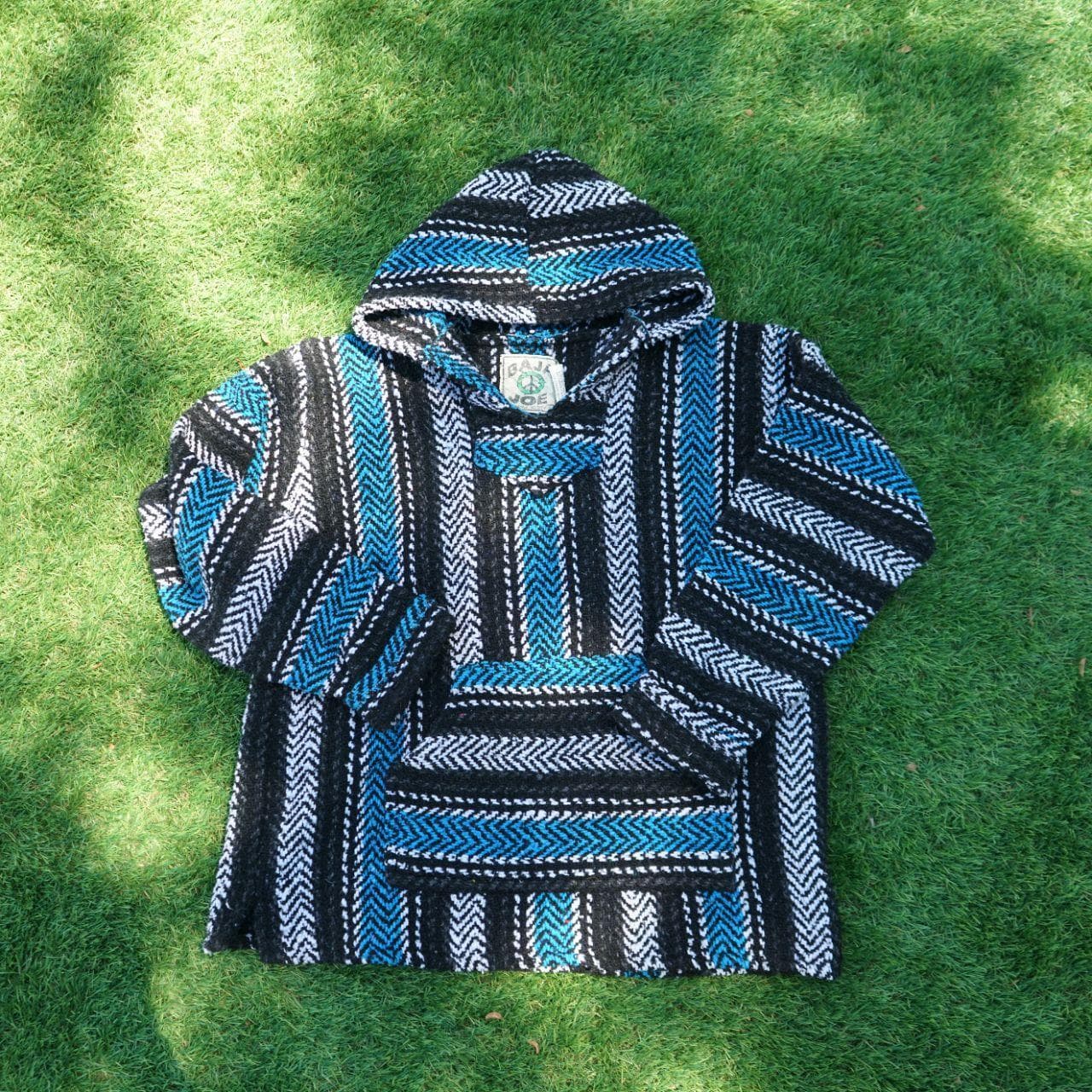 BAJA Joe Mexican blanket pullover hoodie from Central America. Size adult small/medium. Features a heavy, breathable knit with a front pocket and hood.