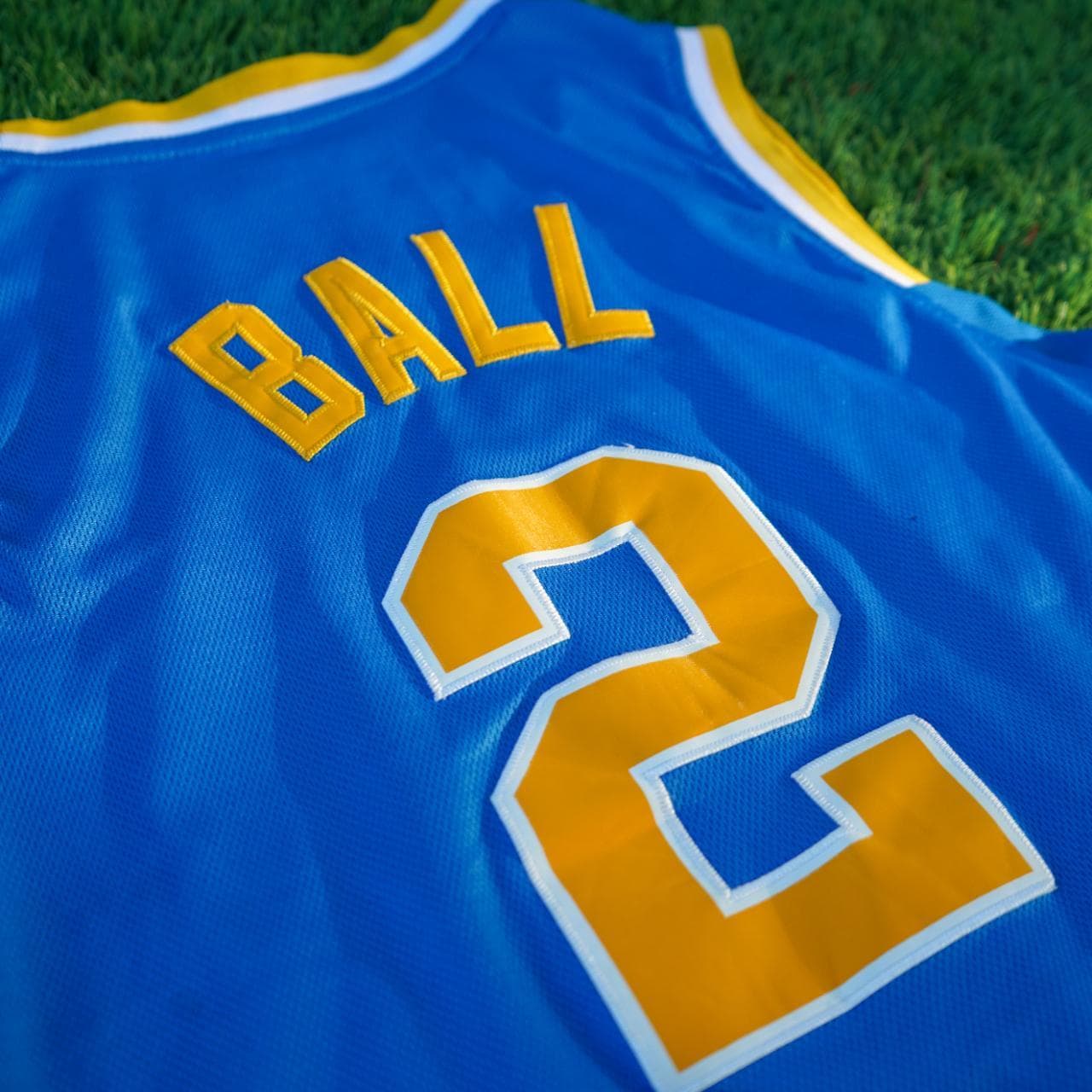 Adidas NCAA UCLA (2) Ball jersey in powder blue and gold. Size adult small. Features stitched graphics on the front and the back. - Thumbnail 6