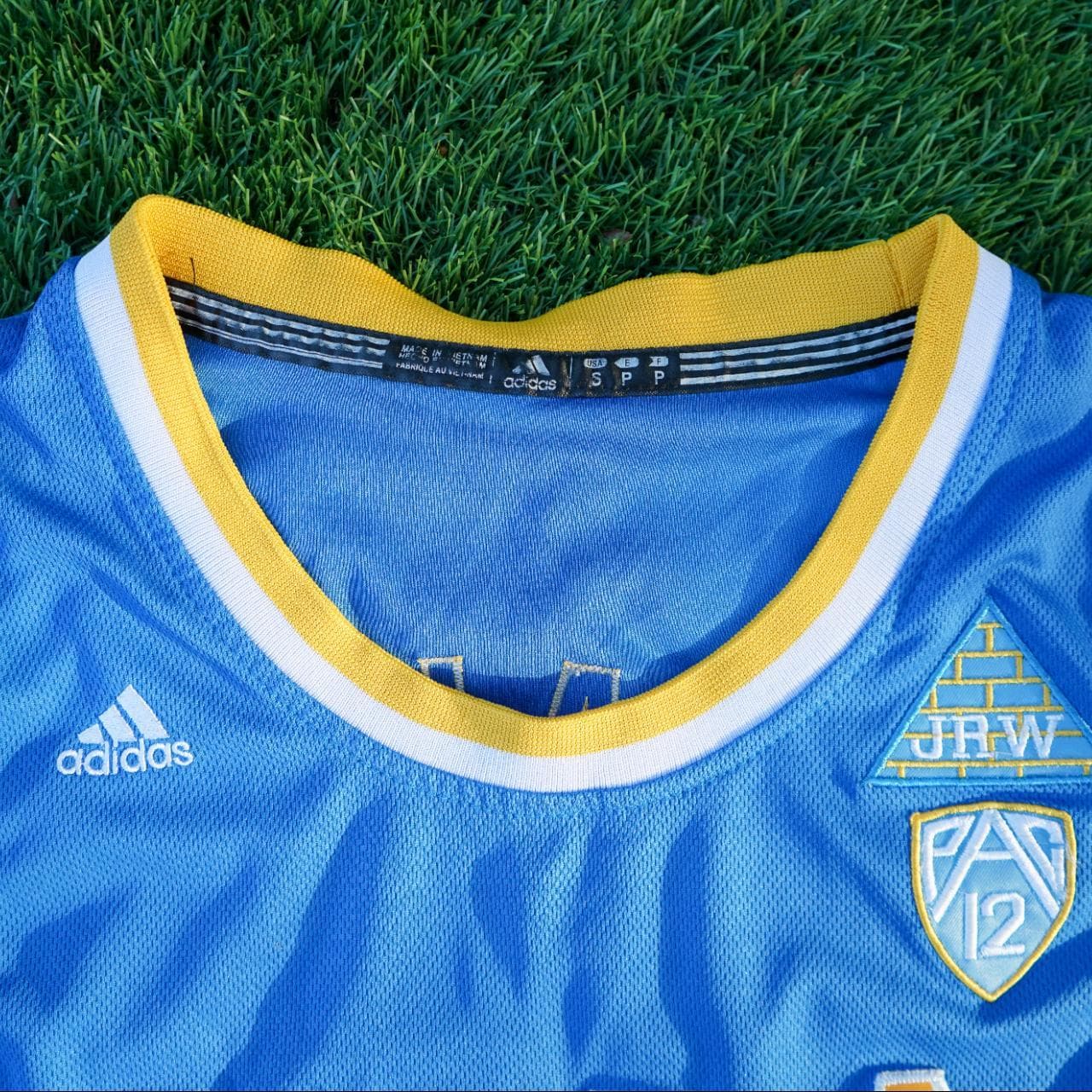 Adidas NCAA UCLA (2) Ball jersey in powder blue and gold. Size adult small. Features stitched graphics on the front and the back. - Thumbnail 2
