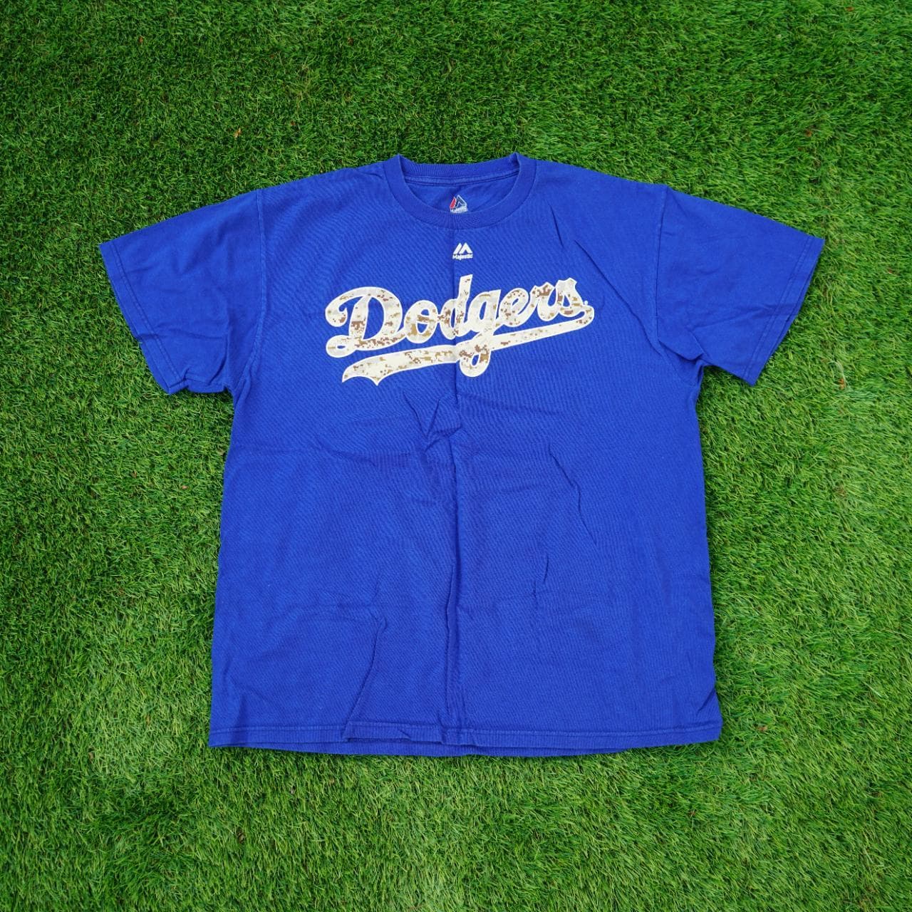 LA Dodgers t-shirt featuring camo logo, and numbers/name for Yasiel Puig (66). Dodgers blue tee with screenprint graphics on the front and back. Size adult large.