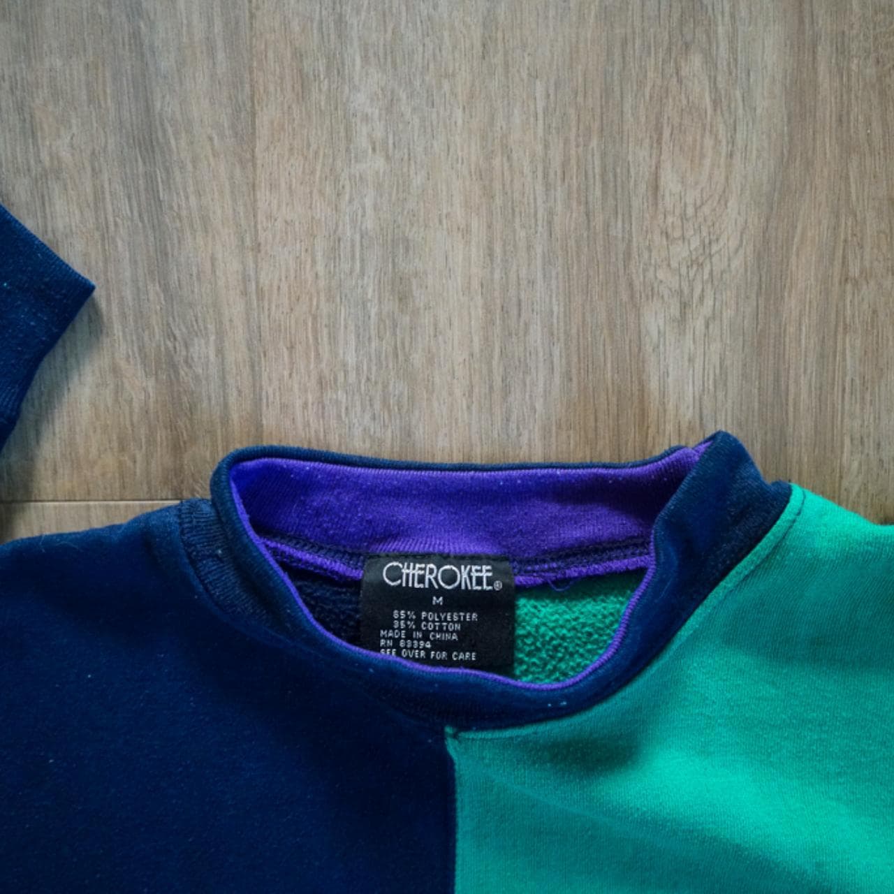 Vintage #Cherokee pullover #sweatshirt with color blocking. Green and navy with a hint of purple around the collar. Small branding on front left chest with exaggerated stitching throughout. #90s - Thumbnail 3