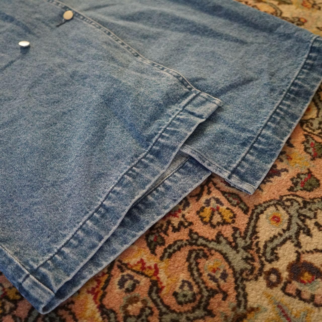Very cute assymmetrical denim skirt in women's small. Features a front pocket, button closure, and asymmetric bottom. - Thumbnail 3
