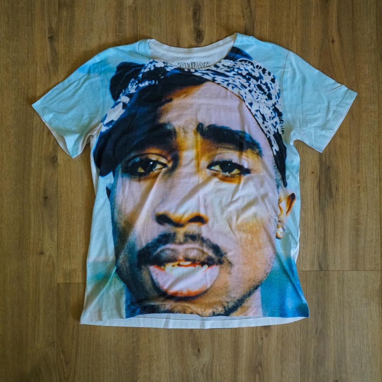 Overprint #Tupac tee. Adult size medium. Features full-color overprint graphic on front and sleeves. White back.