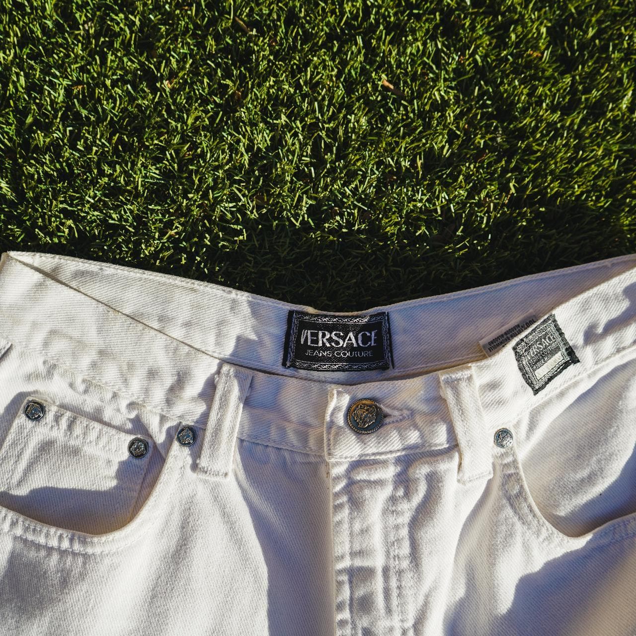 Versace white denim pants in size 34. Vintage style women's jeans that run small. Probably fits more like a 31. Features Versace logo details and original Medusa buttons. The pants are in great shape and picked locally in Los Angeles.
