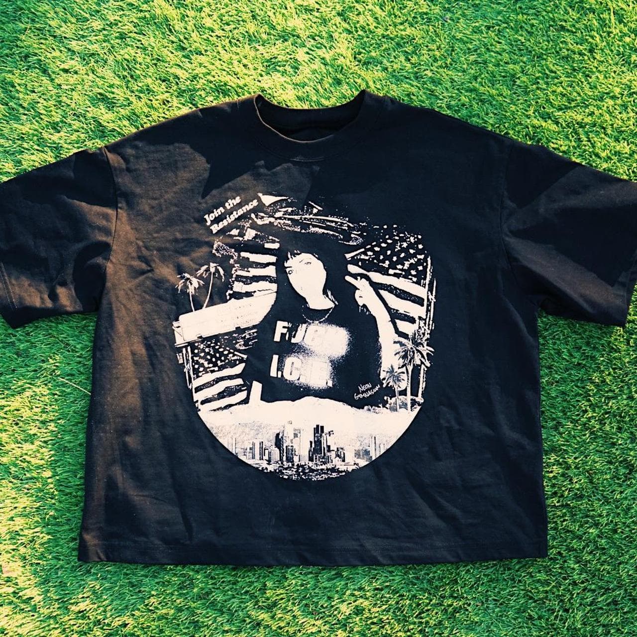Abolish ICE collage tee from Neon Gymnasium. Collage graphic on the front with helicopter graphic on the back.