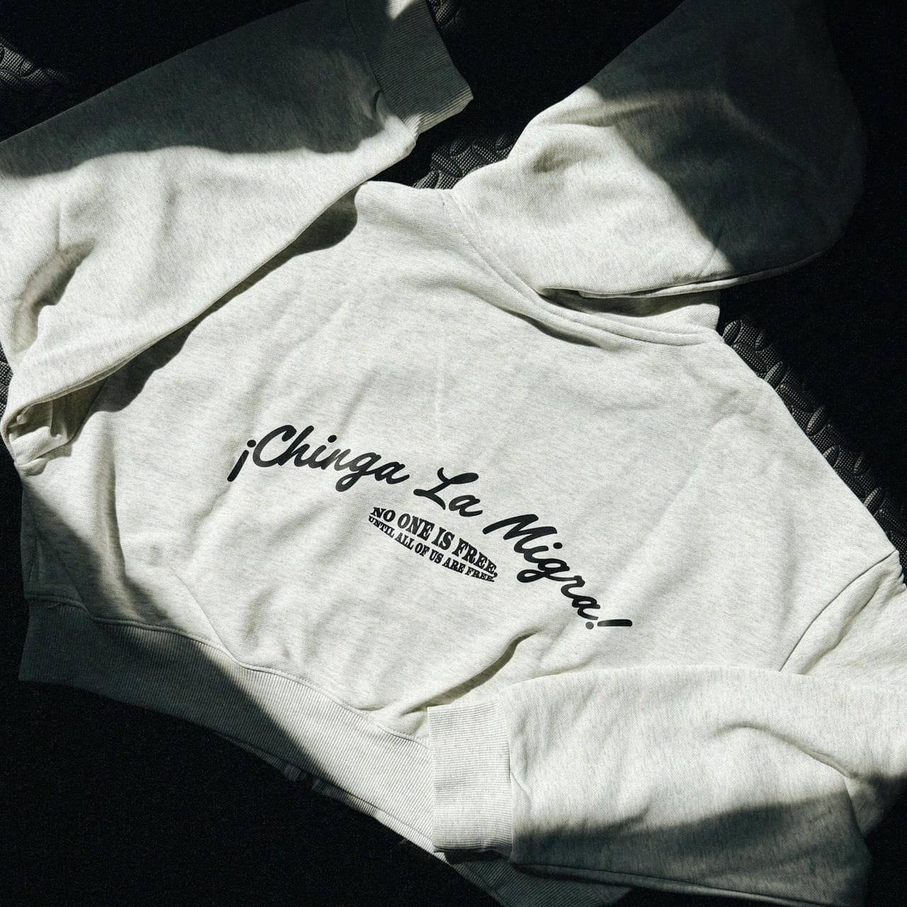 Grey cropped zip up hoodie by Neon Gymnasium. Features metal tone zipper and accents with a graphic on the front and text on the back. Available in S-XXL. - Thumbnail 3