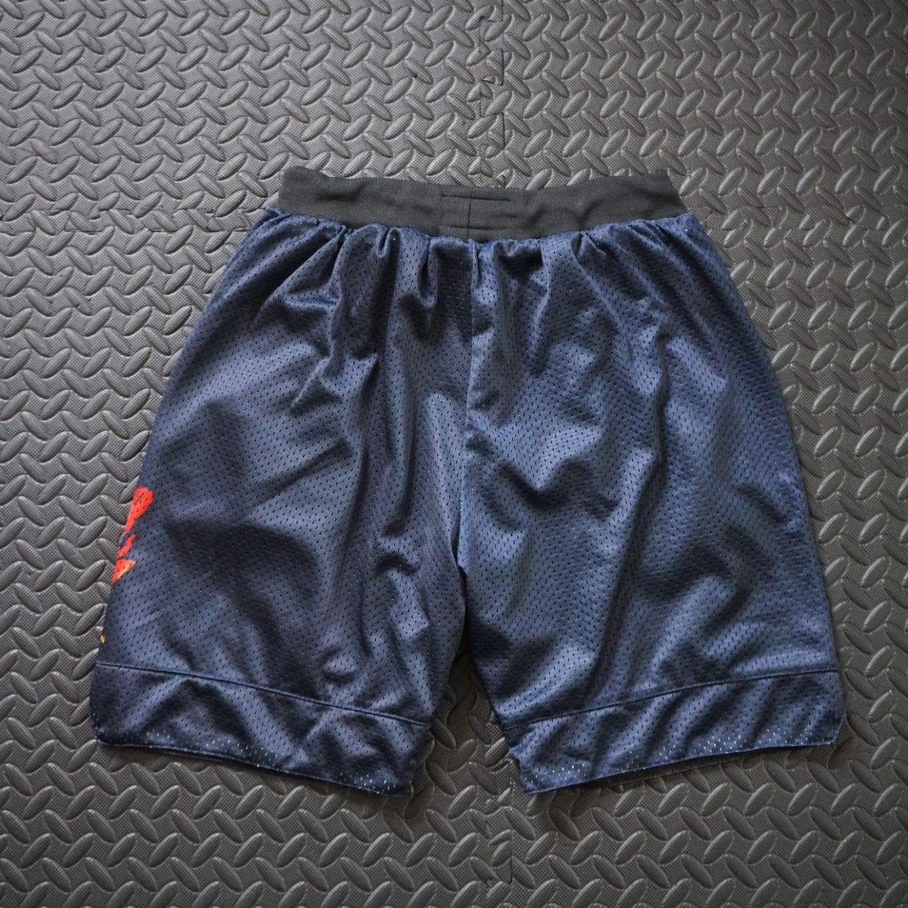 Ricardo D'Sean, DC Based streetwear brand, basketball shorts in adult small. Basketball shorts feature heavy mesh, a drawstring waistband, and zippered pockets. Shorts are also reversible and all black on the other side. - Thumbnail 4