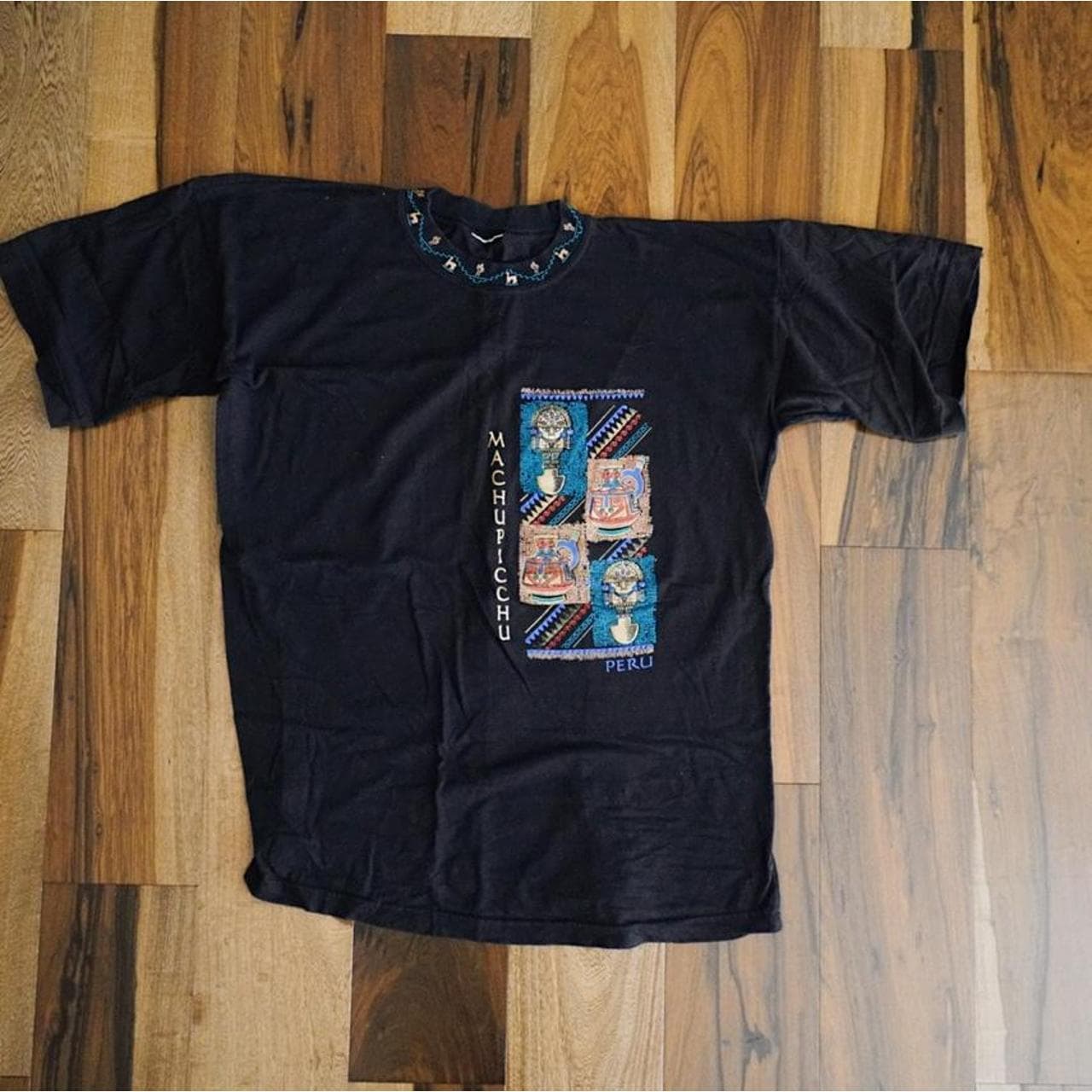 Machu Piccu resort tee in Black with graphics on front and along the neck. Size Medium 🌵