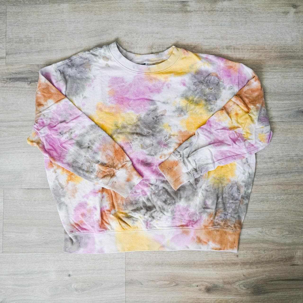 Oversized tie-dye crewneck in women's medium. Grey, yellow, orange, and pink all over dye with elastic cuffs.