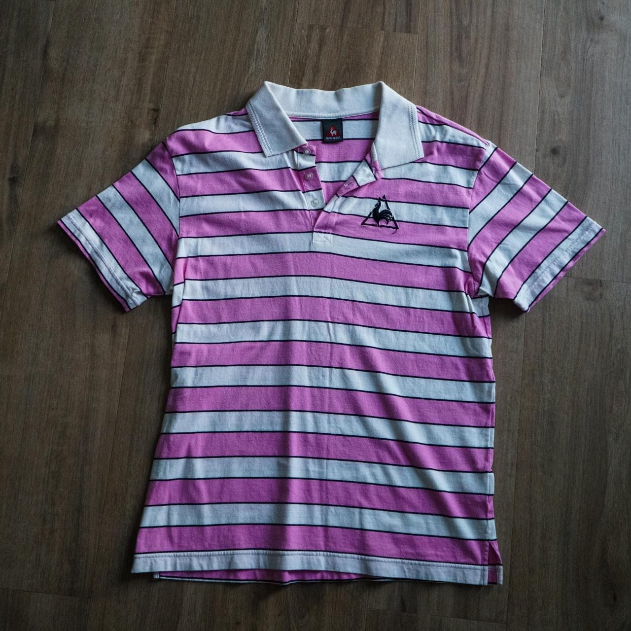 Pink and white #LeCoqSportif polo tee with logo on front and back 👕 Size large.