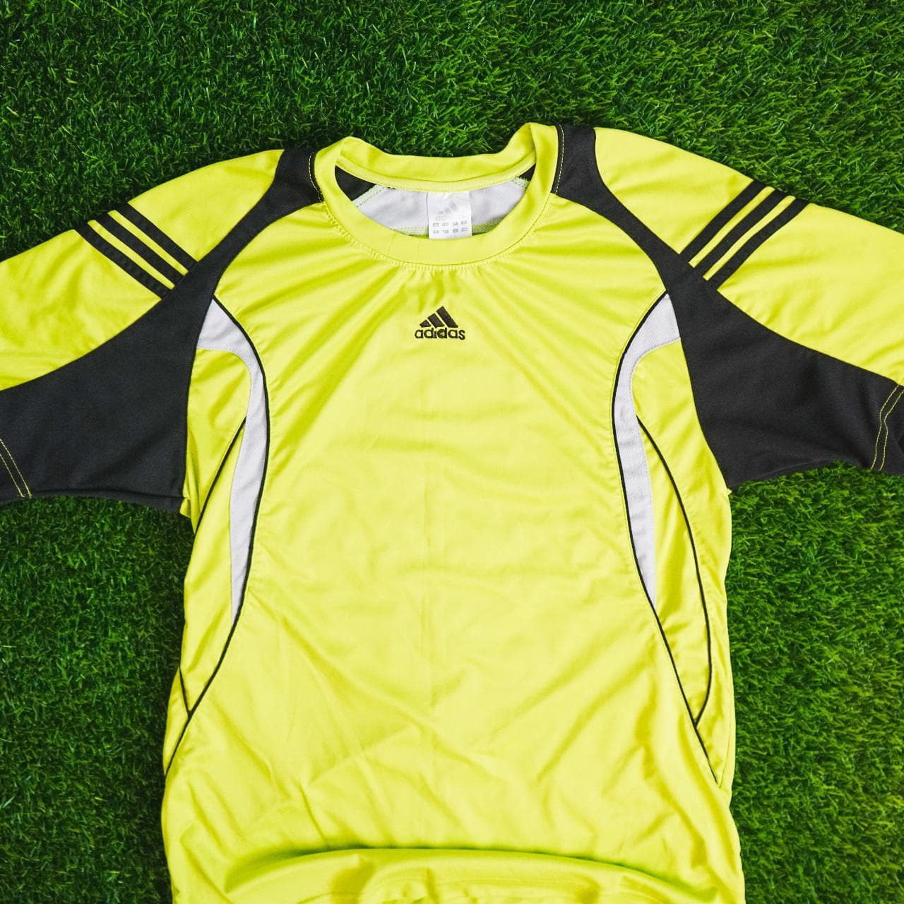Highlighter #Adidas practice soccer jersey with black and grey accents. Features Adidas logo on the front and three stripes on sleeves. Kid's XL, fits like an adult small ⚽️