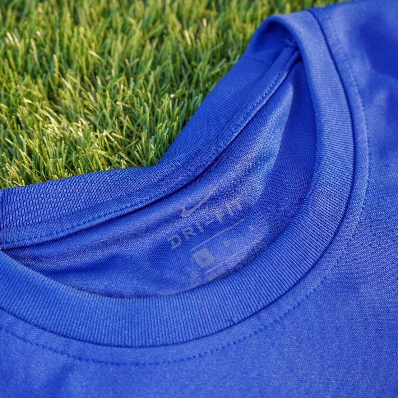 Nike soccer jersey in royal blue, navy, and highlighter orange. It features an embroidered logo, monogram print throughout, and dri-fit material. Size: adult large. - Thumbnail 3