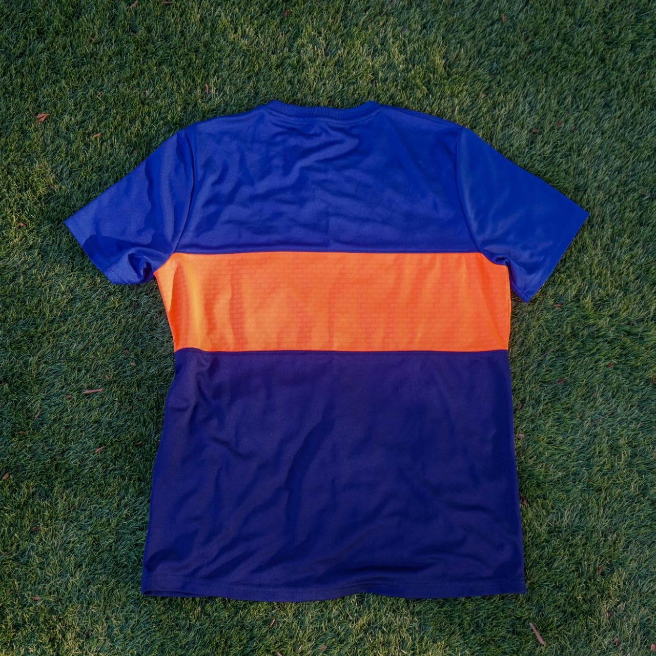 Nike soccer jersey in royal blue, navy, and highlighter orange. It features an embroidered logo, monogram print throughout, and dri-fit material. Size: adult large. - Thumbnail 4