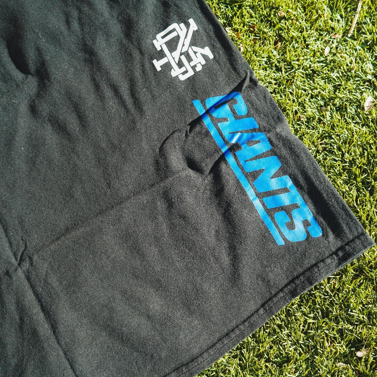 New York Giants tee with reflective 3M logo on front. On the back seam is an additional set of logos. Great NFL tee for Giants fans. Size Adult XL 🏈 - Thumbnail 3