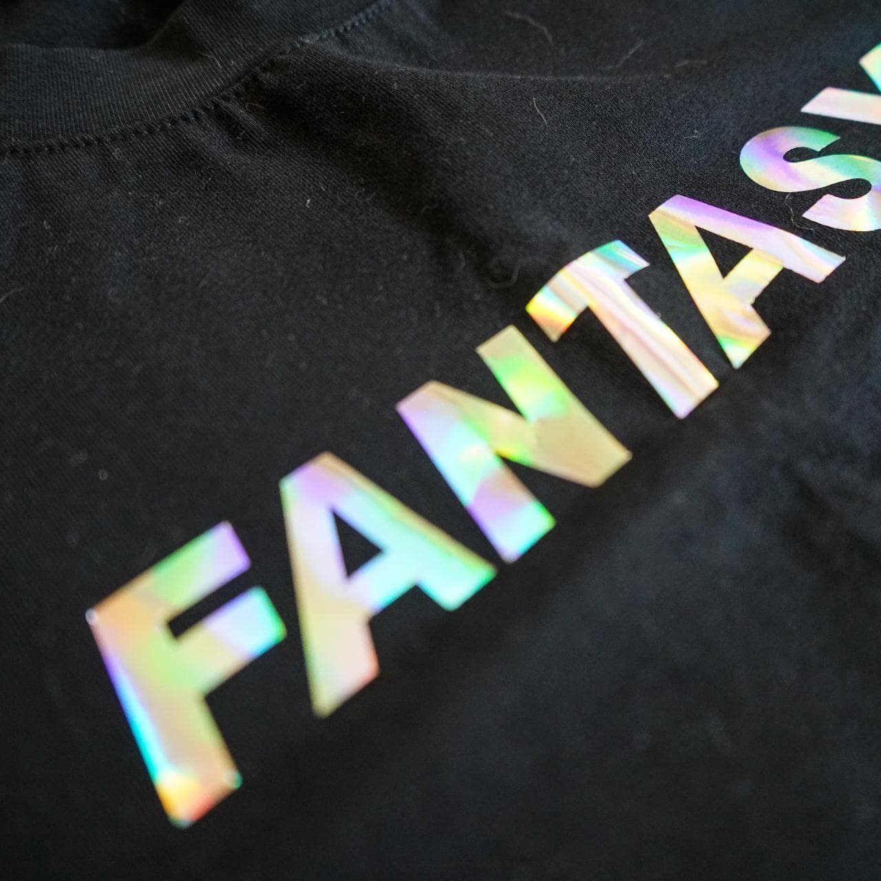 Fantasy crop top in black with holographic text. Stretchy fabric, women's size small. - Thumbnail 2
